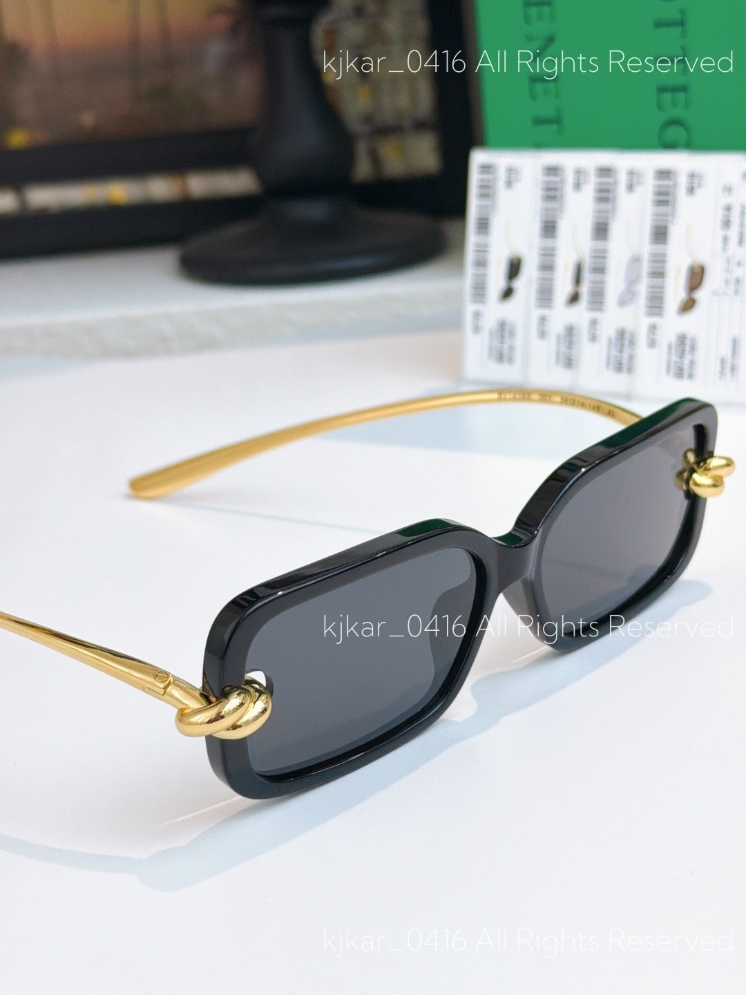 Bottega Veneta BV1439S Women’s Sunglasses Black Frame Gold Knot Gray Lenses