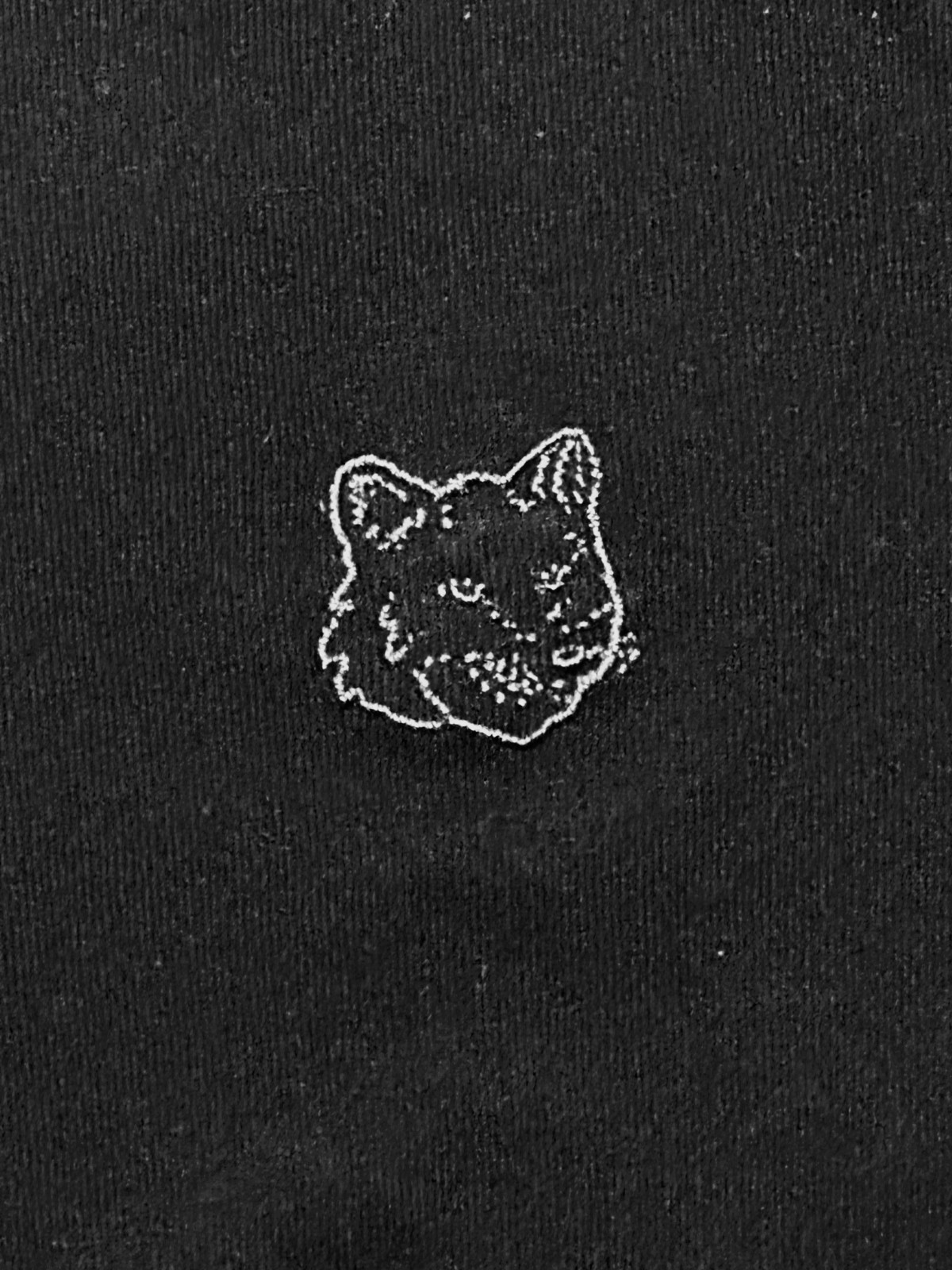 Small black long sleeve crew neck Maison Kitsuné x Eva Air logo shirt in black
