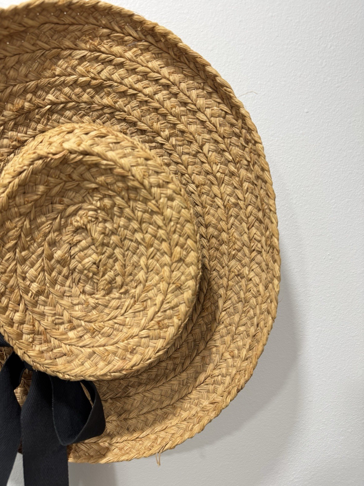 Helen Kaminski handwoven raffia sun hat with black ribbon made in Madagascar