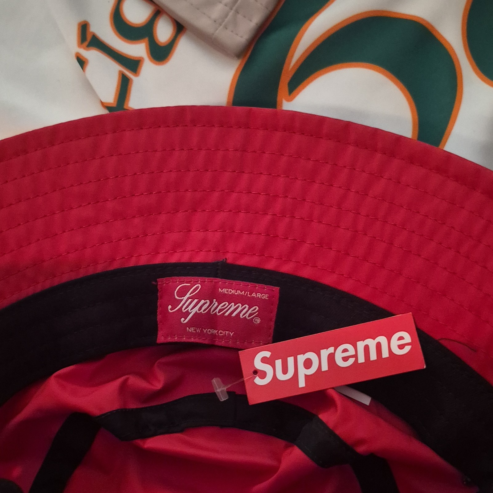 Supreme N.Y.C Red Bucket Hat with Silicone Stripe across crown water resistant