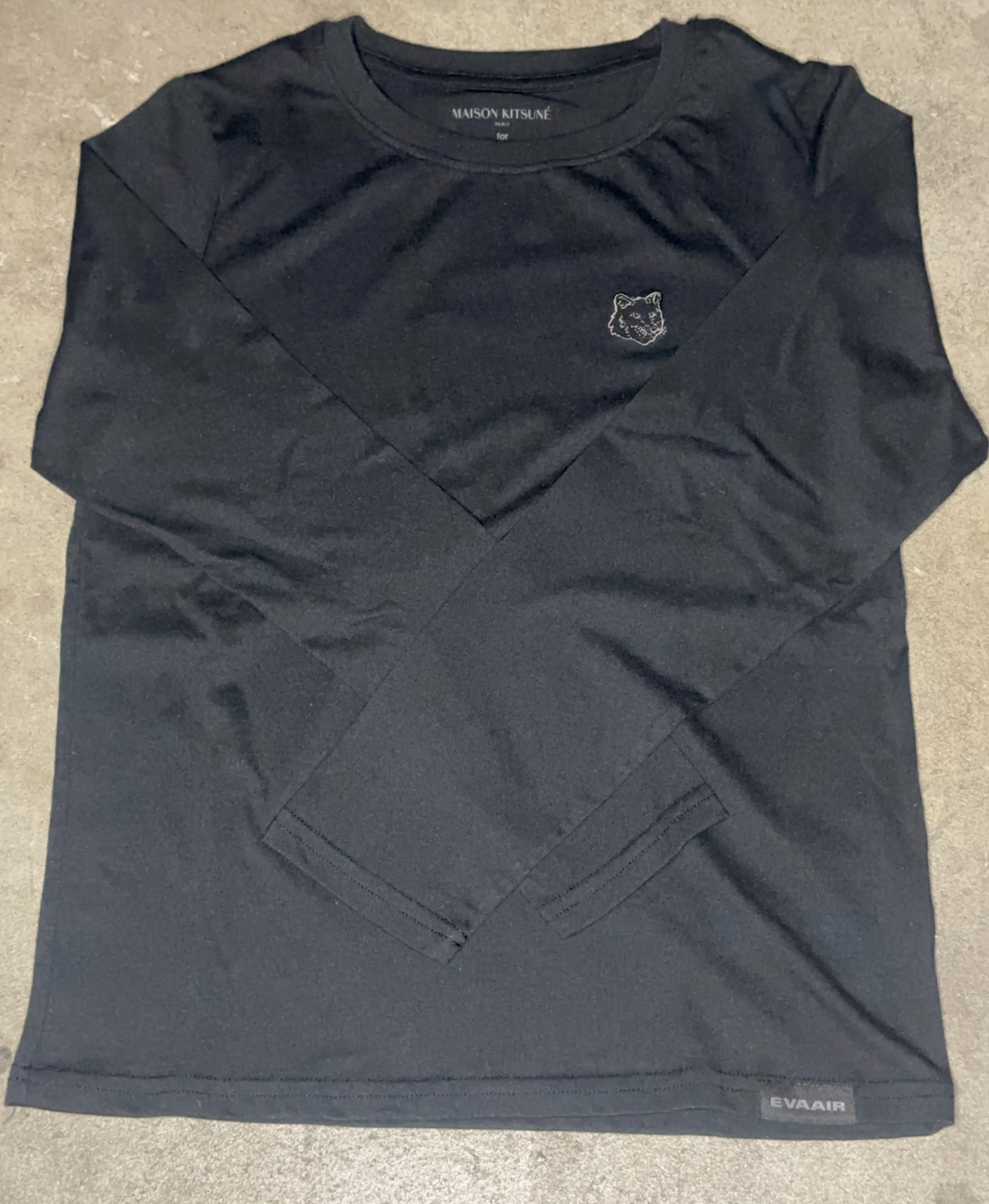 Small black long sleeve crew neck Maison Kitsuné x Eva Air logo shirt in black