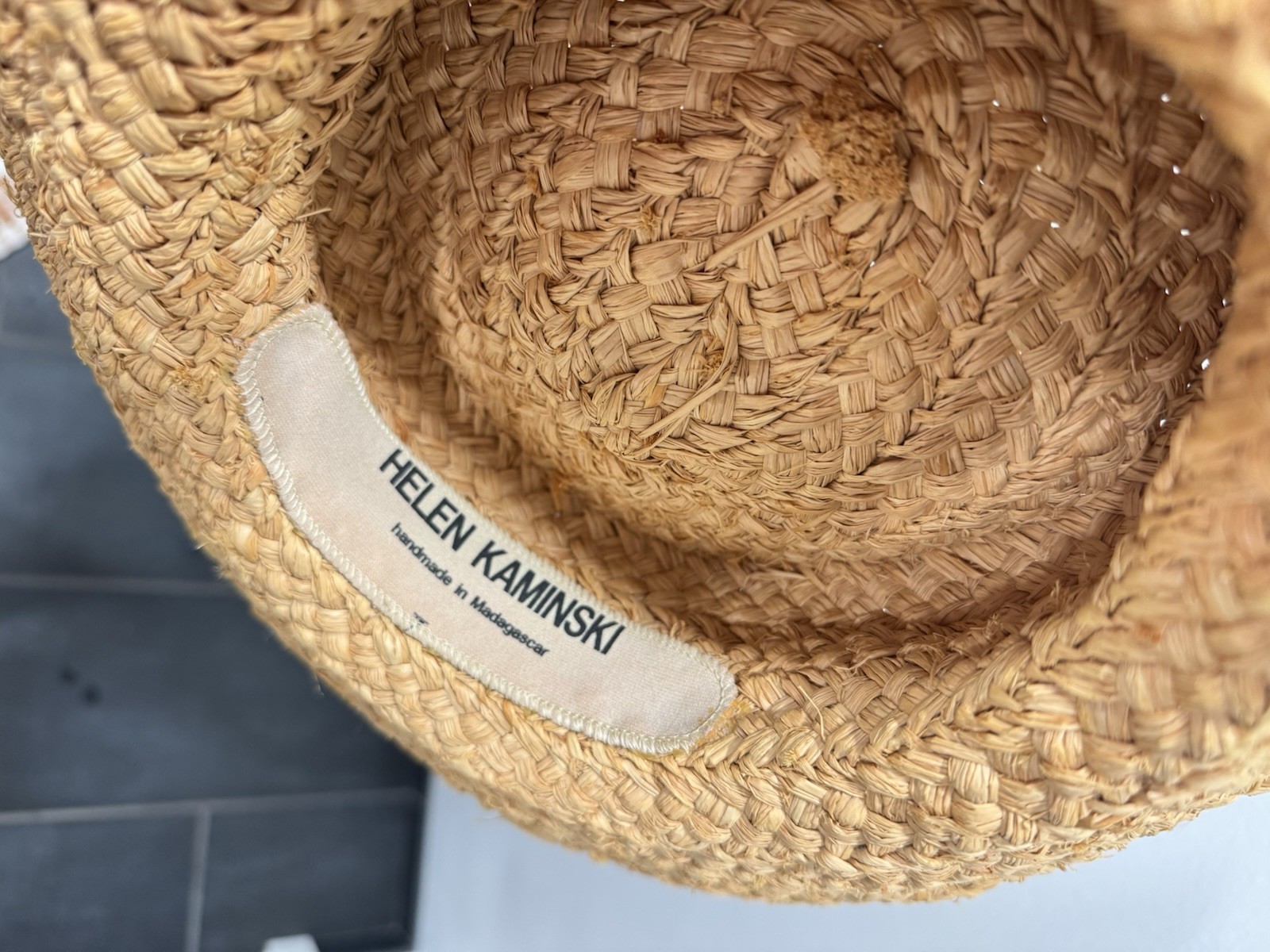 Helen Kaminski handwoven raffia sun hat with black ribbon made in Madagascar
