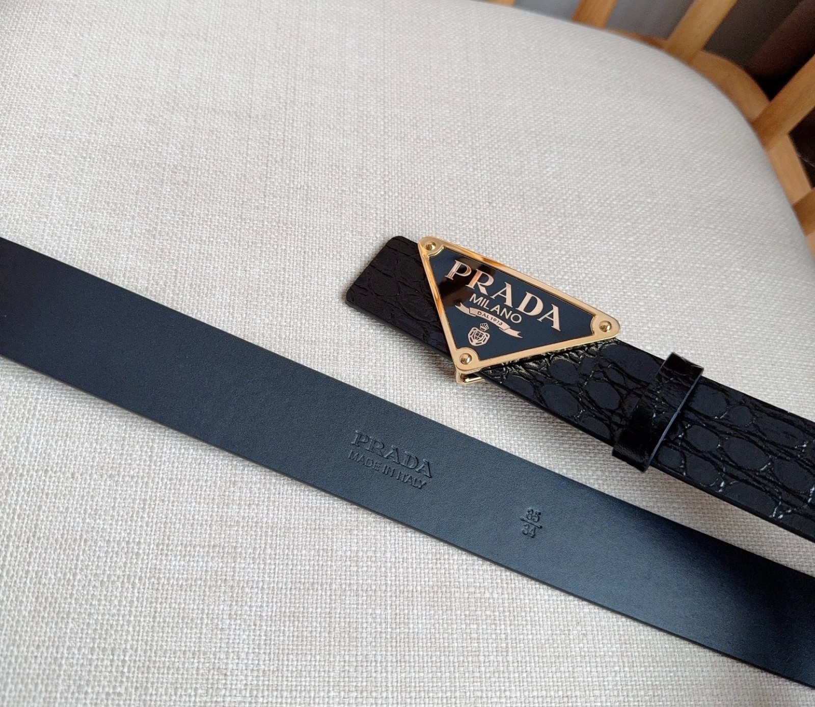 Prada men’s black-button black leather belt