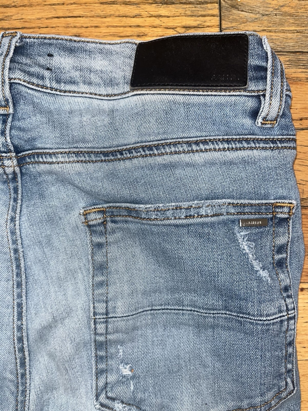 AMIRI Men’s Light Wash Distressed Skinny Slim Fit Blue Denim Jeans