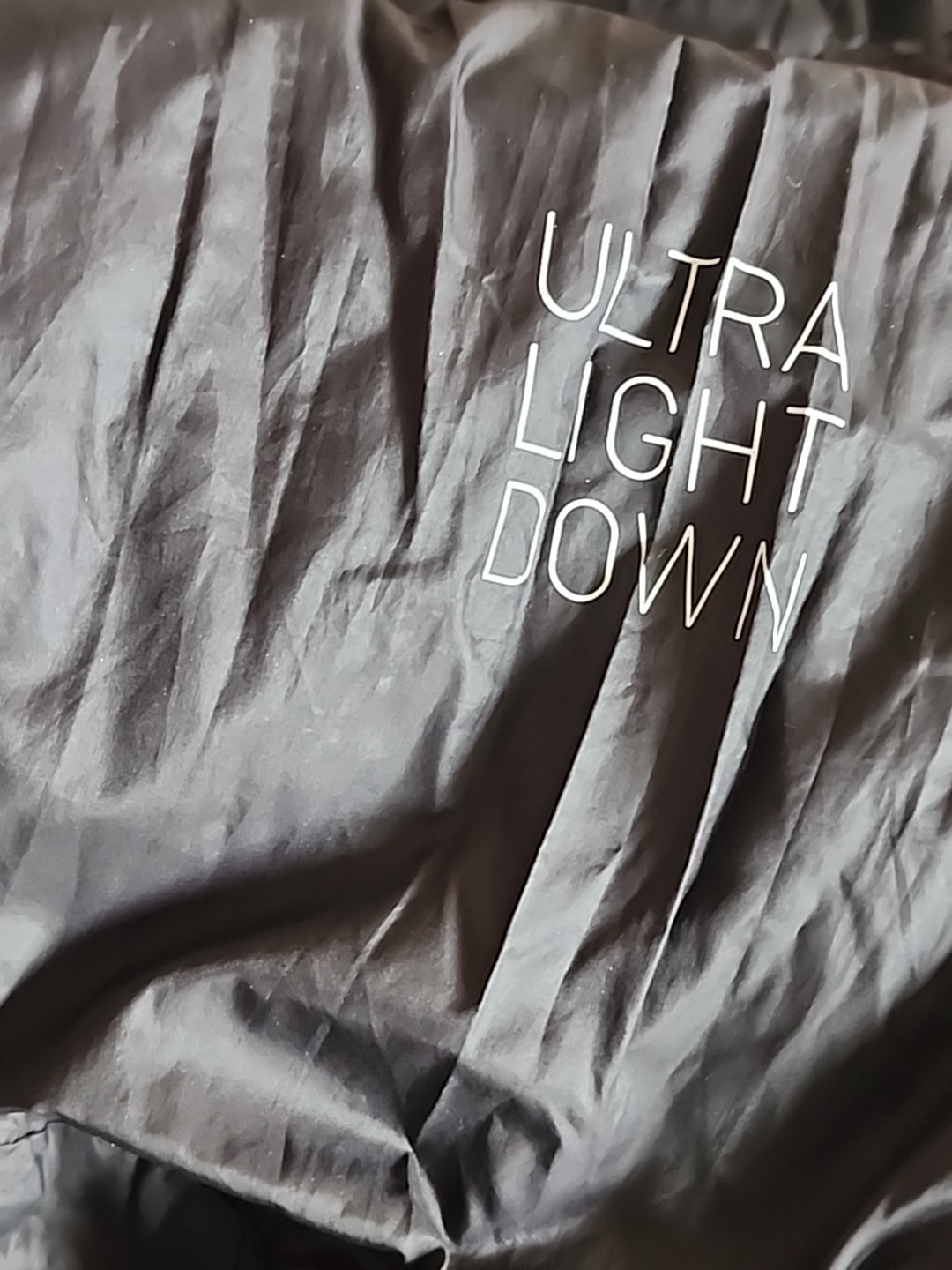 Target Brand: UN1 QLO. SZ .S .WATER.SNOW PROOF. SF.BLACK .VERY LIGHT. POUCH.