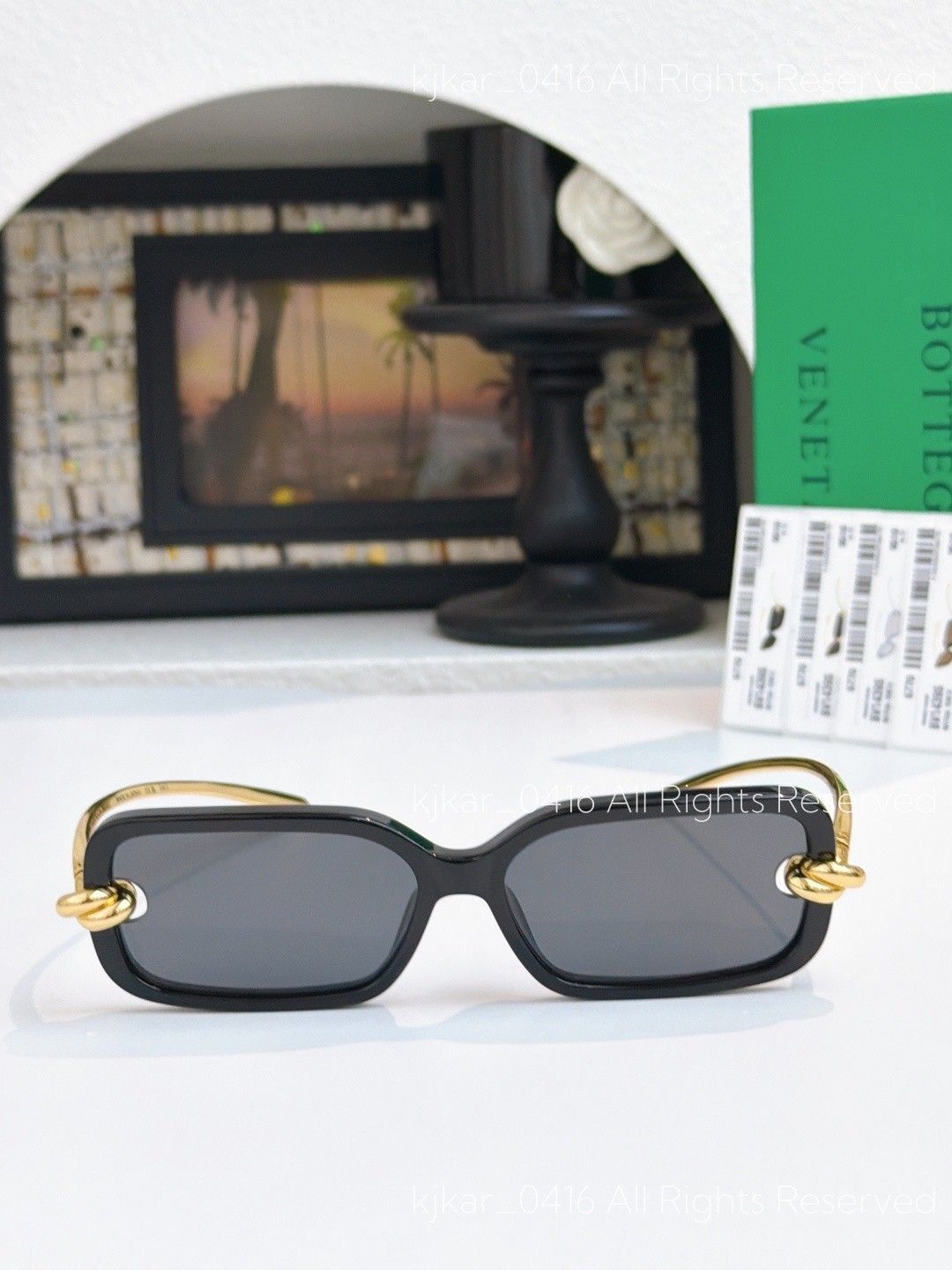 Bottega Veneta BV1439S Women’s Sunglasses Black Frame Gold Knot Gray Lenses