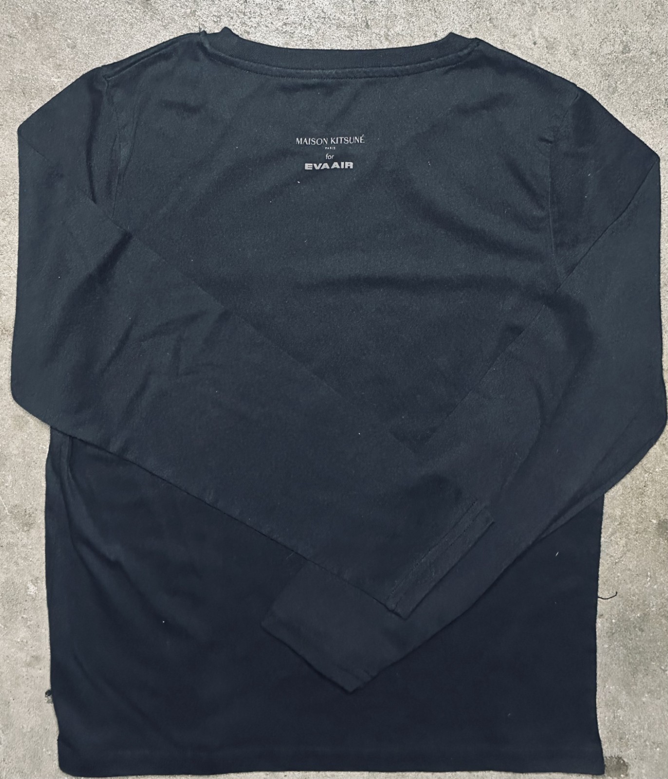 Small black long sleeve crew neck Maison Kitsuné x Eva Air logo shirt in black