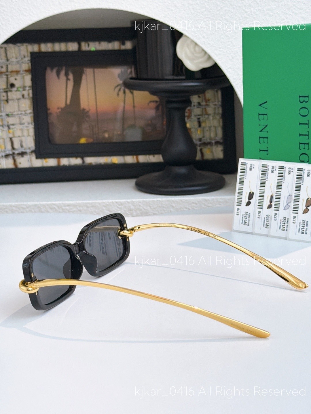 Bottega Veneta BV1439S Women’s Sunglasses Black Frame Gold Knot Gray Lenses