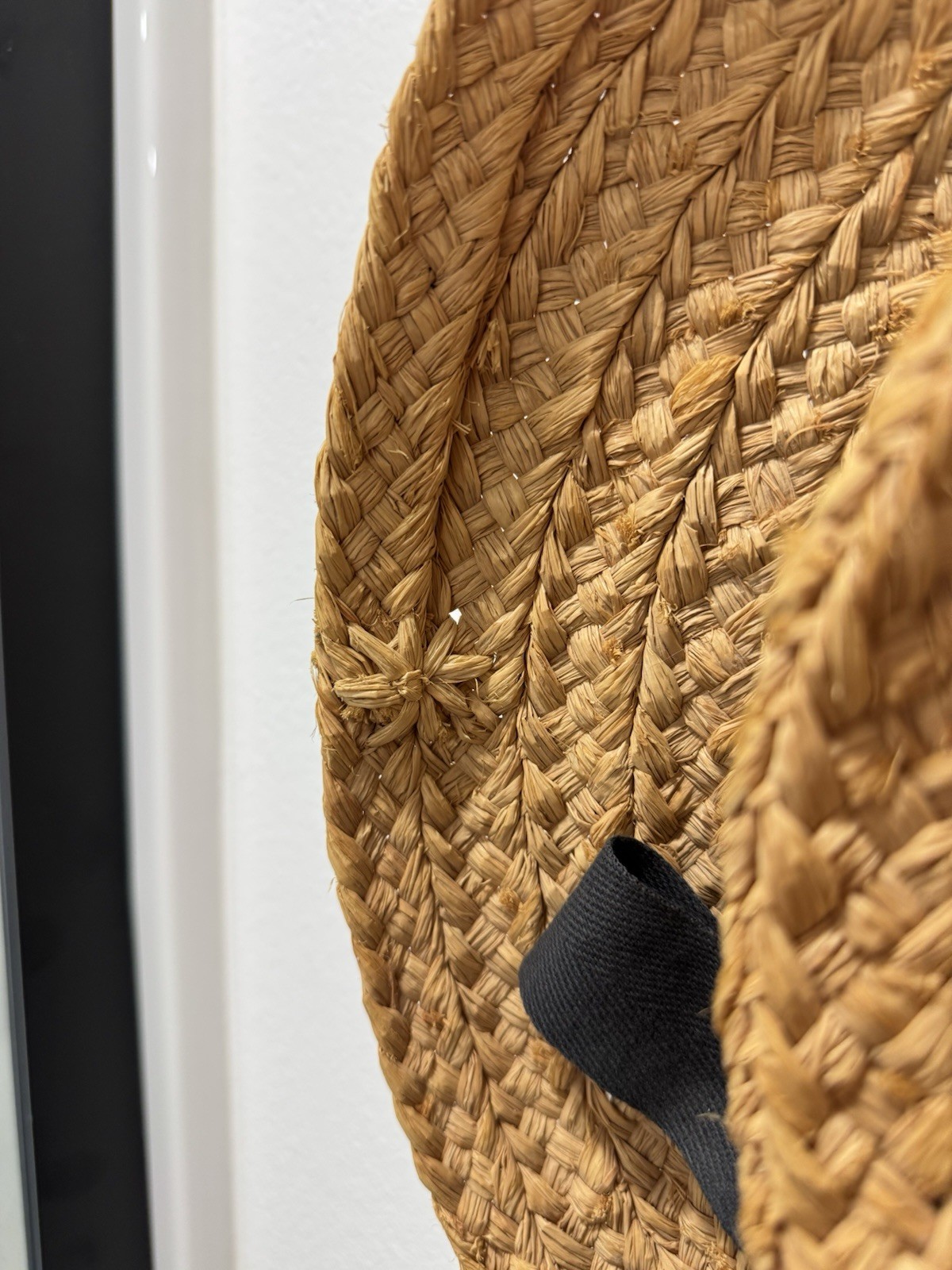 Helen Kaminski handwoven raffia sun hat with black ribbon made in Madagascar